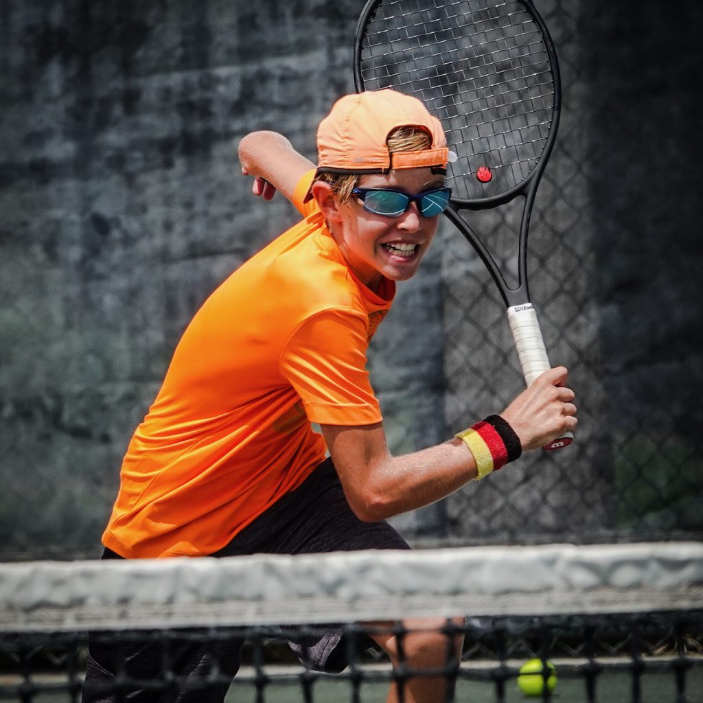 Quentin playing tennis